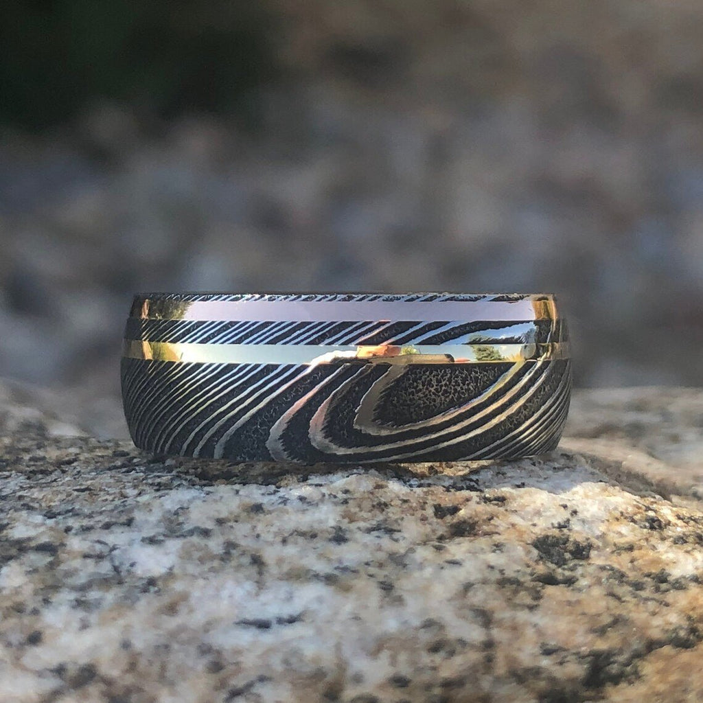 8mm Damascus Steel Ring with Dual 14k Yellow Gold & Rose Gold Off Center Grooves and a Arizona Ironwood Sleeve